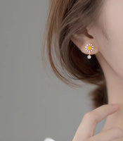 Daisy Flower Silver Stud Earrings modeling