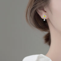 Daisy Flower Silver Stud Earrings modeling silver studs 